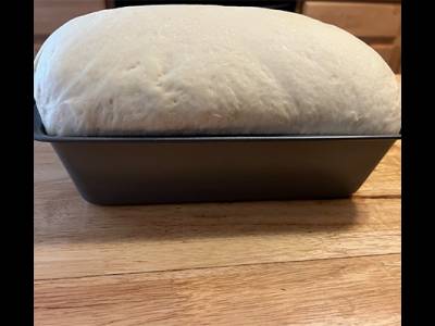 bread dough crowning the 9x5 bread pan