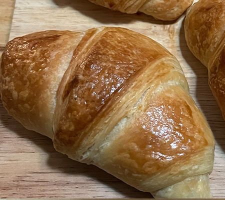 Croissants on a wooden board